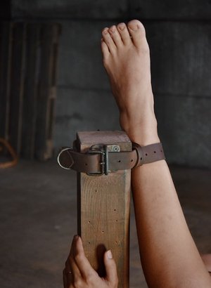 18 year old female Doris G slips off her underwear to pose naked on her bed